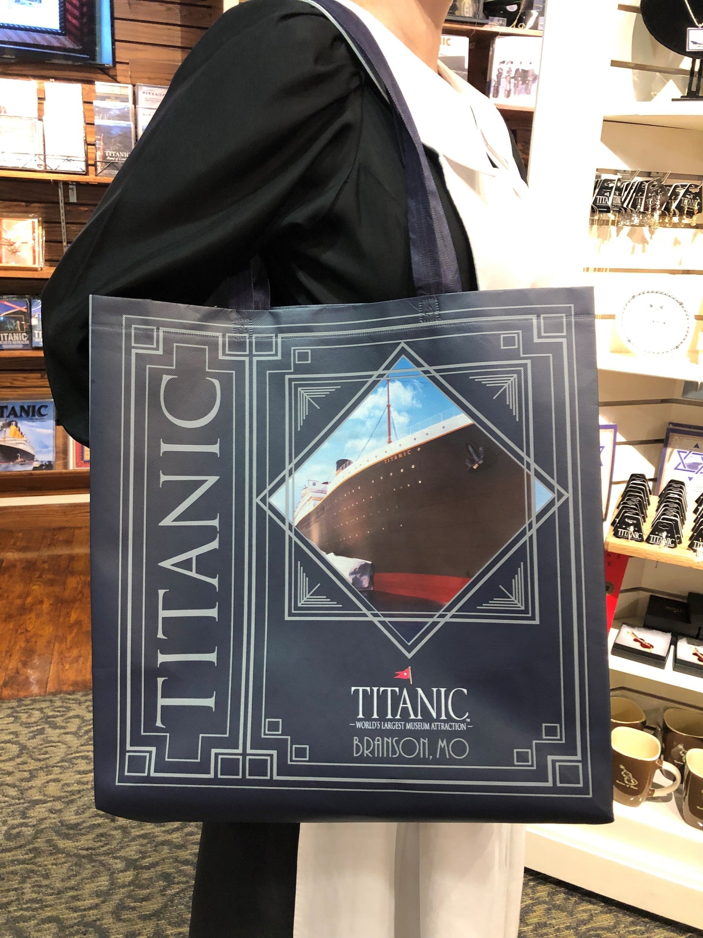 Third angle of navy shopper tote with full design clearly displayed.
