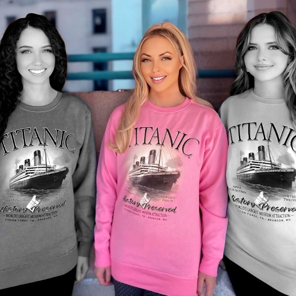 A young woman wearing a bright bubblegum pink Titanic sweatshirt.