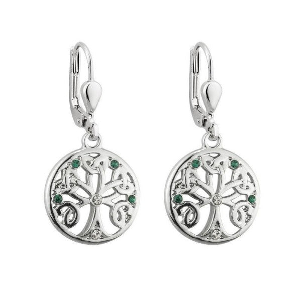 A pair of silver-tone round drop earrings depicting a tree with branches woven into Trinity Knots. They are accented with small clear and green crystals. Hinged lever back hook earrings.