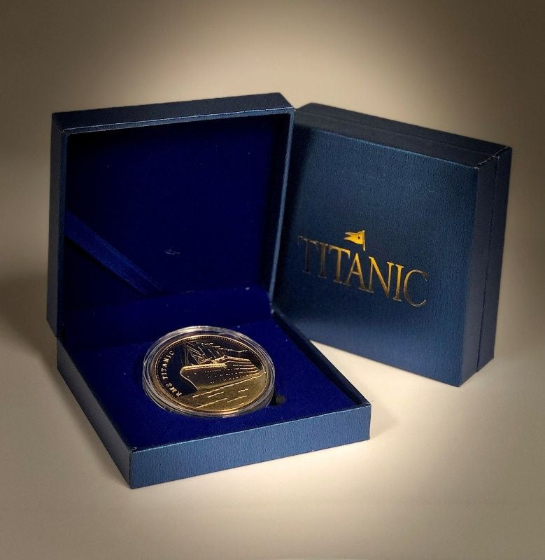 Gold color collector coin in custom blue Titanic box.