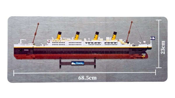 A side view of the fully intact display option resting on the included base. The dimensions are stated as 68.5 centimeters long and 23 centimeters high.