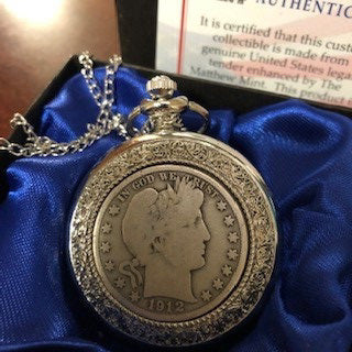 A silver tone pocket watch with a genuine 1912 