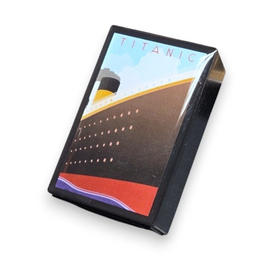 A small black box with a vibrant and very angular illustration of Titanic's bow.