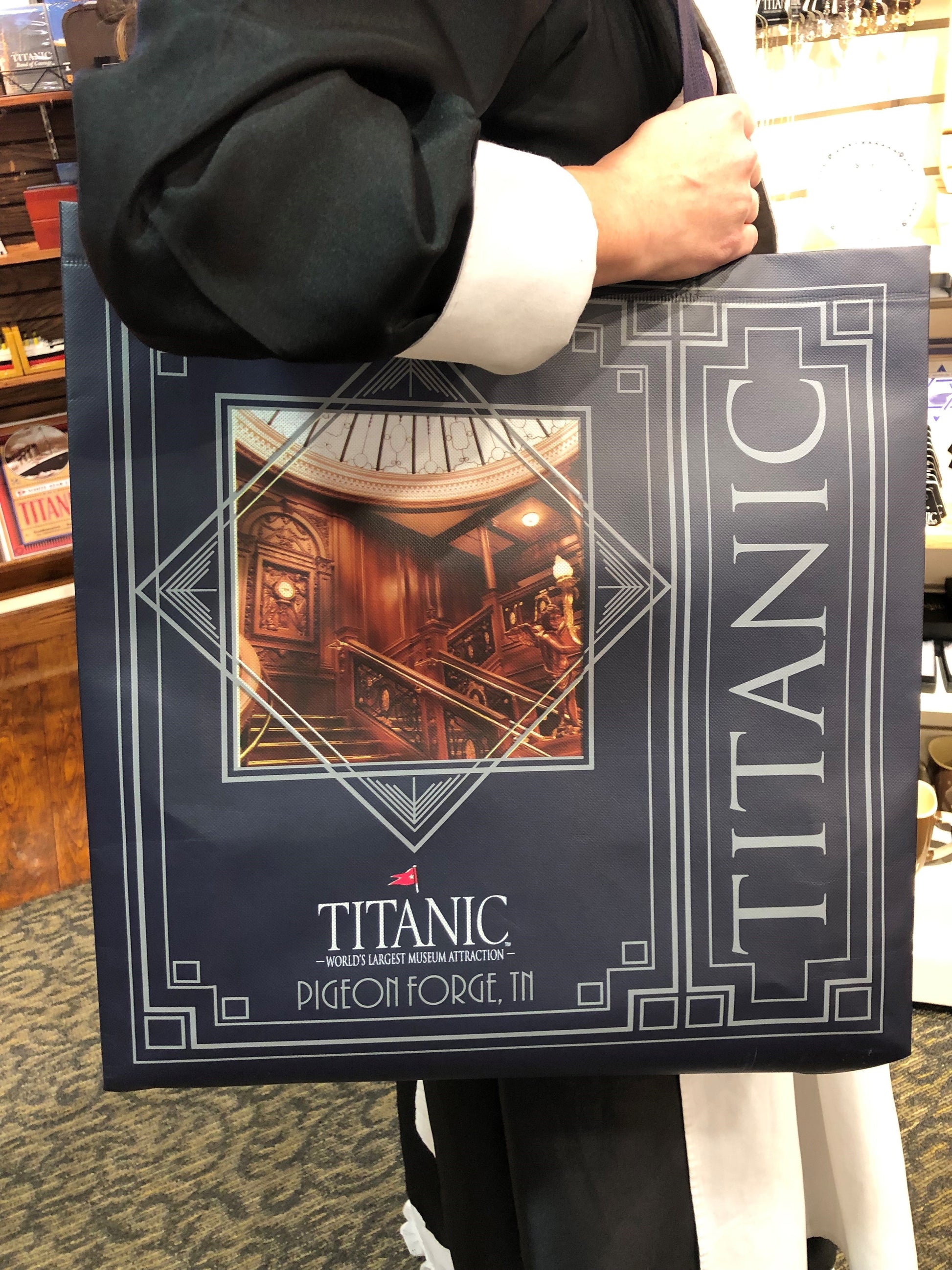 Alternate side of navy art deco tote showing the Grand Staircase.