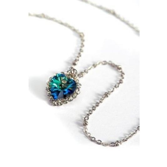 Aqua blue crystal heart pendant with small clear crystals on a necklace chain.