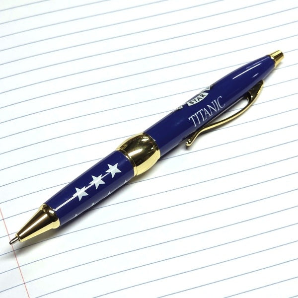 A blue pen with gold accents. This angle shows the word TITANIC and the gold clip.