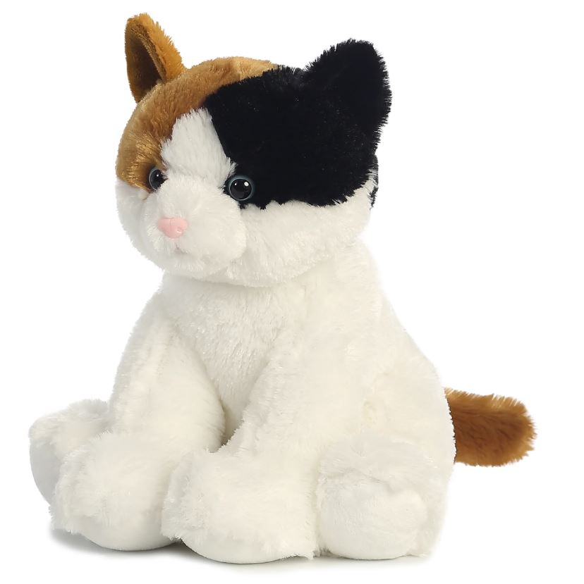 A large plush calico cat. It is mainly white, with accents of brown and black. It is in a sitting position.