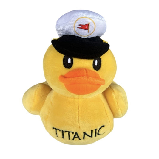 Yellow plush duck wearing a captain hat.