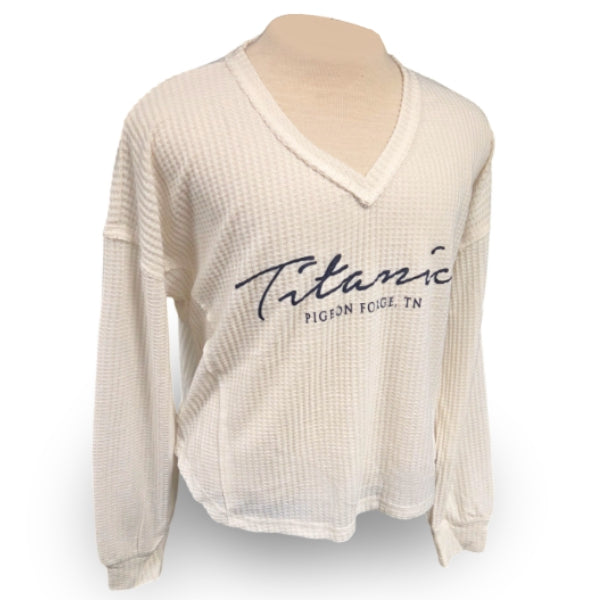 Cream slouchy waffle texture V-neck shirt that says Titanic Pigeon Forge in navy cursive.