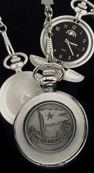 Silver-tone pocket watch with textured border and pewter flag emblem.