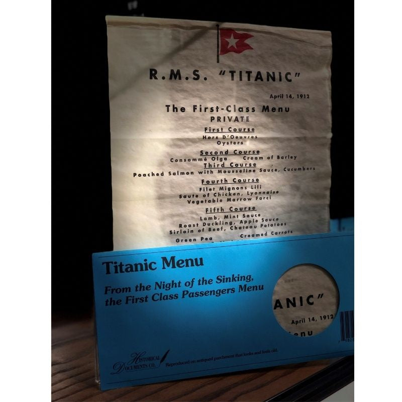 Dinner menu from April 14th, 1912 for First Class. The paper has an antiqued look and feel, and it comes in a blue envelope.