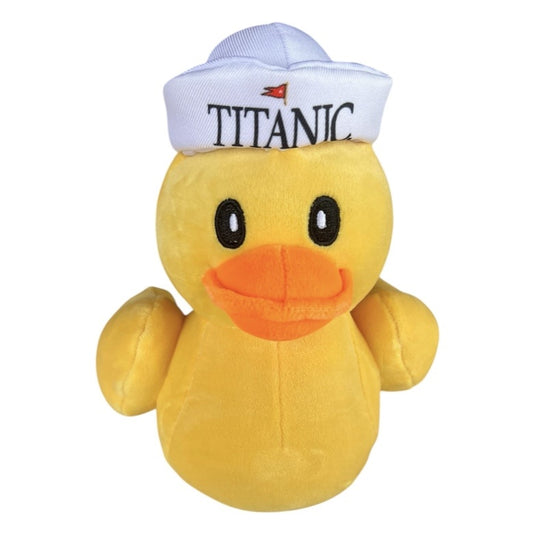 Yellow duck plush wearing a white sailor hat.