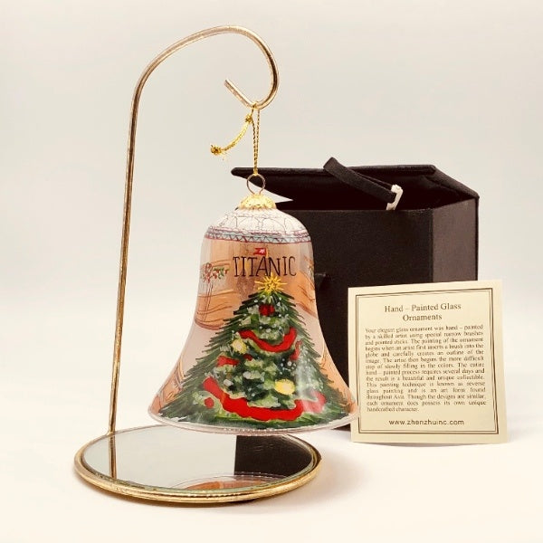 The same as the previous image, showing the back of the ornament with the large Christmas tree and the box and card the item comes with.