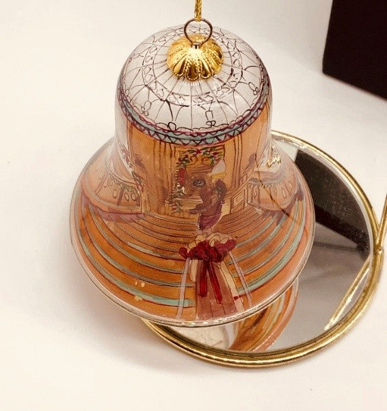 A top-down view of the ornament over a mirror showing the dynamic perspective of the stairs and a peek inside where the painting was applied.