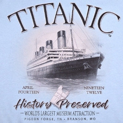 A closeup of the sweatshirt's design depicting the Titanic as a black and white sketch, a life preserver, and the words "TITANIC April Fourteen Nineteen Twelve History Preserved World's Largest Museum Attraction Pigeon Forge, TN Branson, MO."