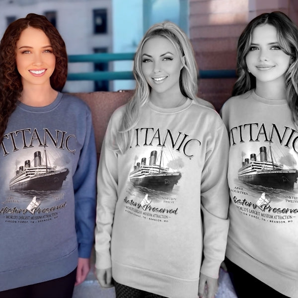 A young woman wearing an indigo navy blue Titanic sweatshirt.