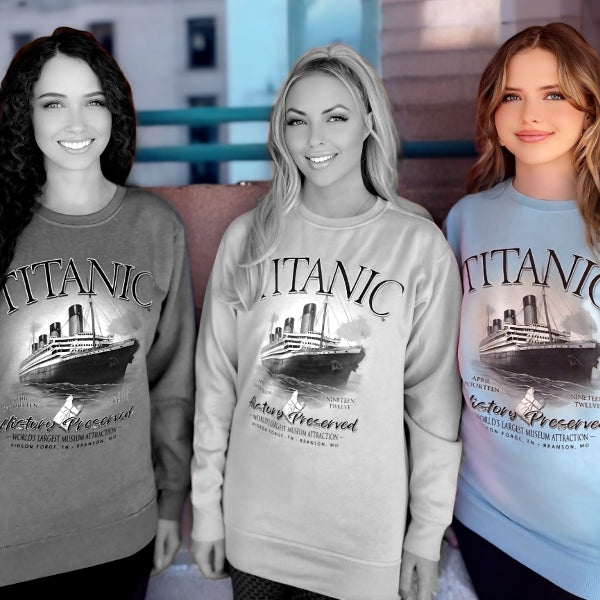 A young woman wearing a light blue Titanic sweatshirt.