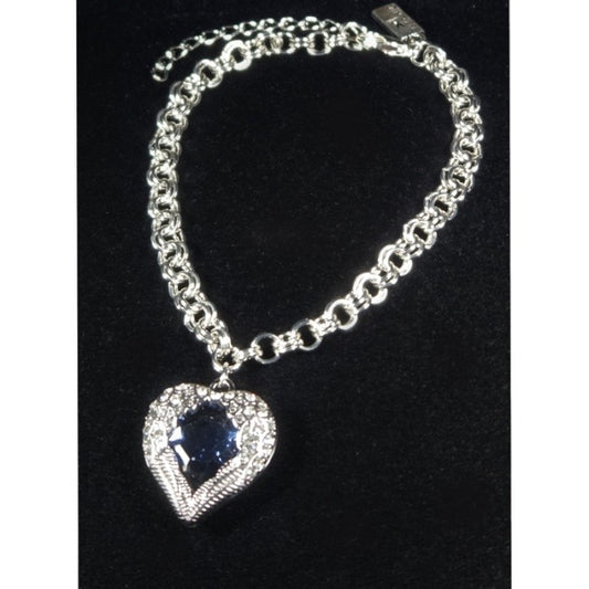 A bracelet with a heart pendant featuring an angel wing design surrounding a blue gemstone.