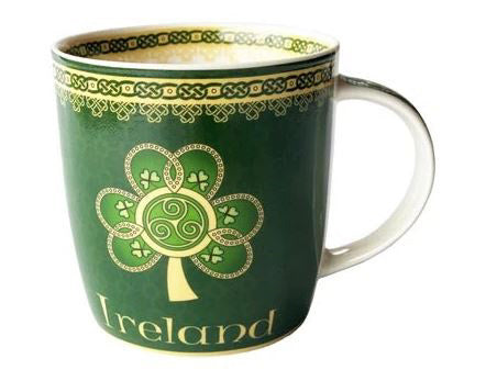 A bone china coffee mug printed with green shamrock and yellow Celtic knot designs. The mug says "Ireland".