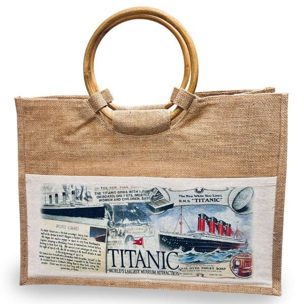 Wide rectangular tote made of loosely woven jute, it has a canvas pocket on the front with Titanic imagery and a round bamboo handle.