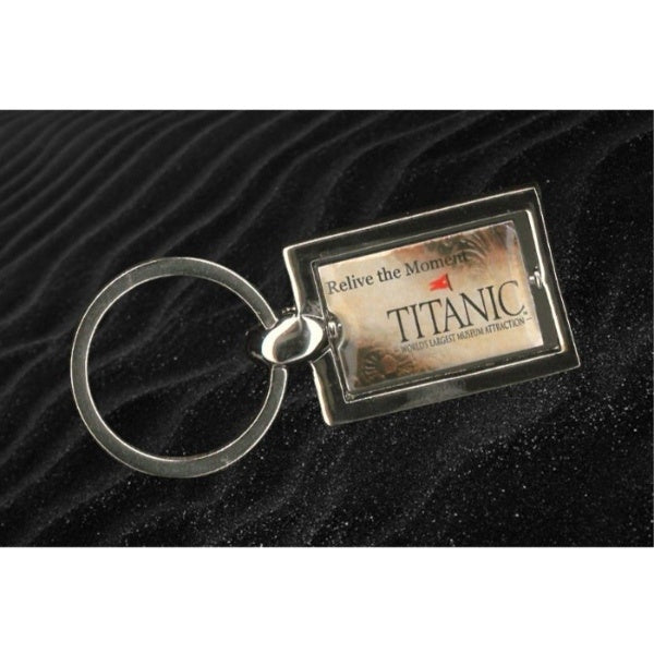 The reverse of the keychain shows pieces of the door frame debris movie prop from the ending of the Titanic movie along with our Titanic museum logo and the catchphrase "Relive the moment".
