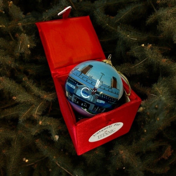 The same view zoomed out to show the entire red satin box the ornament comes in.