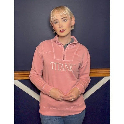 The same woman this time in muted pink with cream colored embroidery.