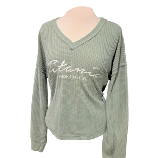 Sage green slouchy waffle texture V-neck shirt that says Titanic Pigeon Forge in white cursive.