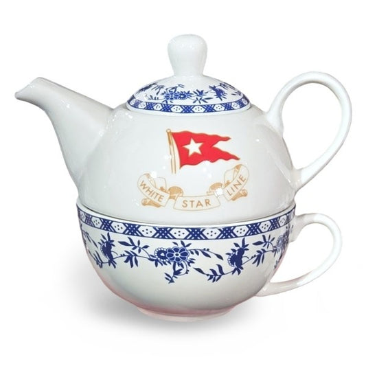A tea-for-one set, meaning a miniature teapot that stacks on top of a slightly large teacup, with a White Star Line red flag logo and a navy blue floral pattern on white ceramic.