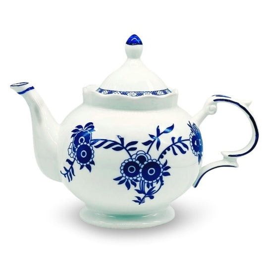 A white ceramic teapot with a mix of hand painted and printed navy blue floral decorations.