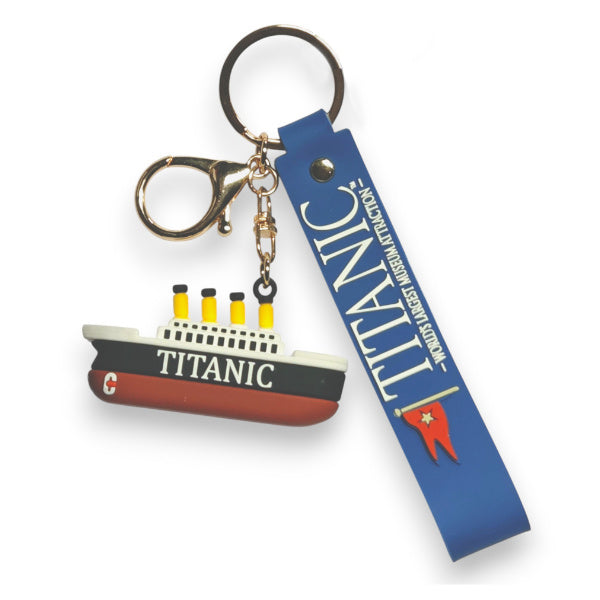 A rubber silicone Titanic shaped keychain charm with a blue silicone wristlet and gold lobster clasp and standard ring key ring.