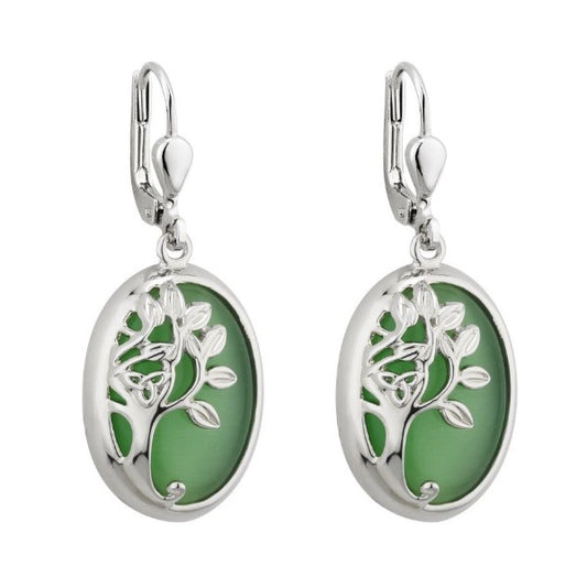 A pair of lever back hook earrings. A green oval cat's eye stone that reflects the light in interesting lines is encircled by silver-tone Rhodium, decorated with a tree and trinity knot design.
