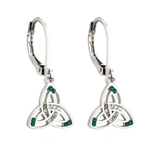 A pair of silver tone trinity knot drop earrings made of two separate lines, hollow between, with clear crystals in the center of the knot and green crystals at the tips between the lines. They have a closed hinge fish hook clasp.