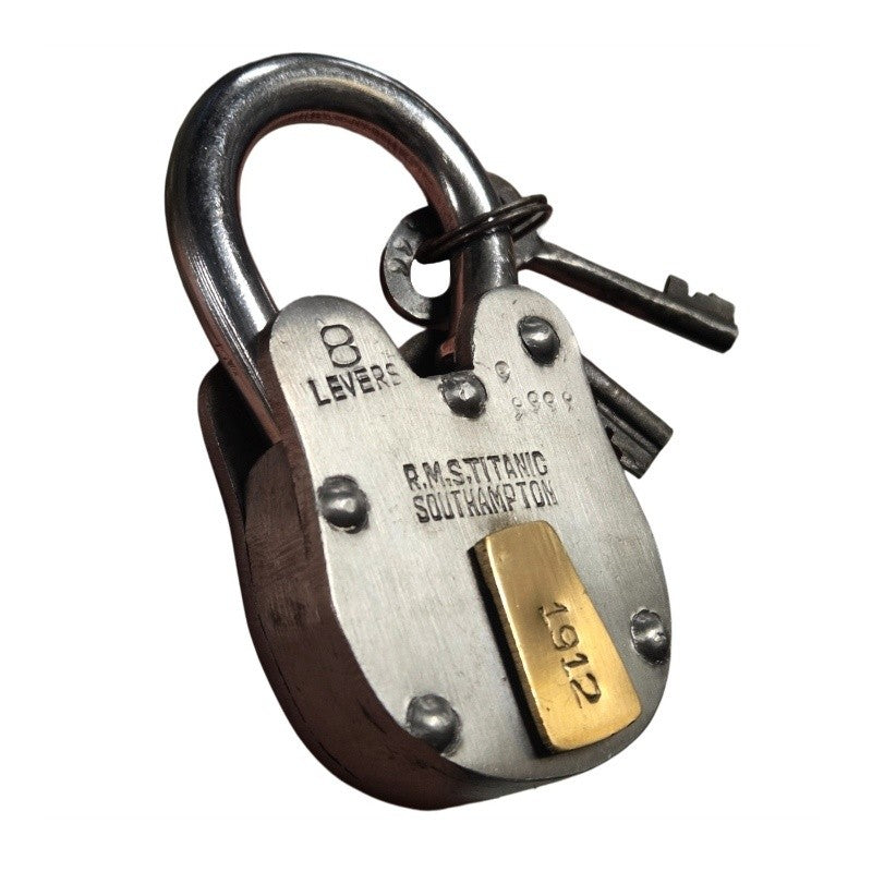 Big lock closed with keys on ring, the lock is thick and looks heavy.