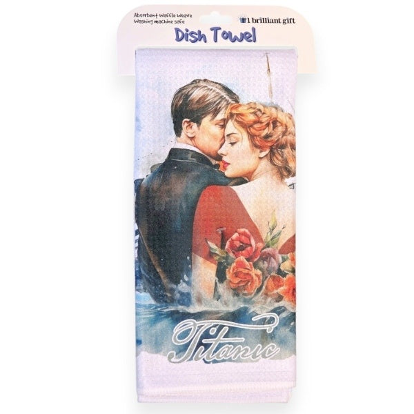 A white waffle-knit dish towel folded neatly and displayed with its packaging. The image printed on the towel is of a fancy couple whispering in each others' ear.