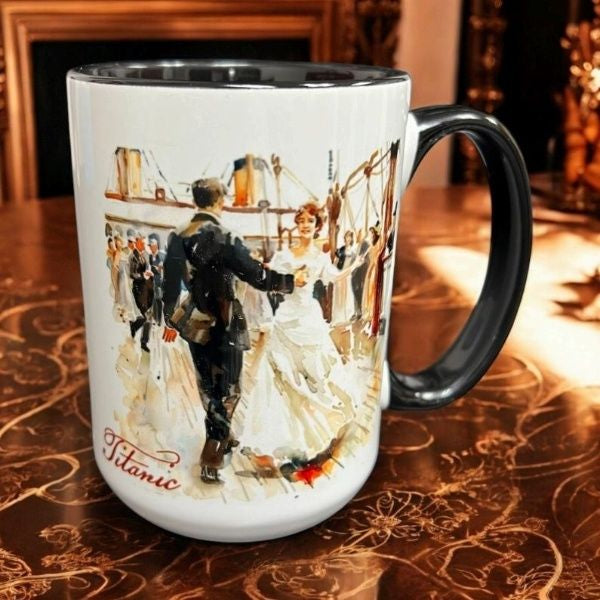 A white mug with black handle and interior, with a watercolor image of a man and woman dancing on Titanic's deck.