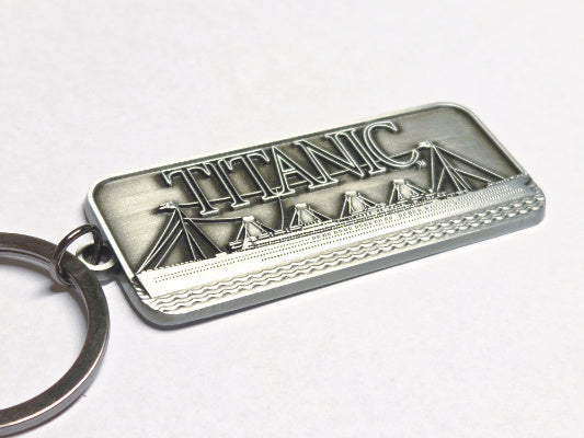 Another angle of the rectangular key ring showing the detail along the ship.