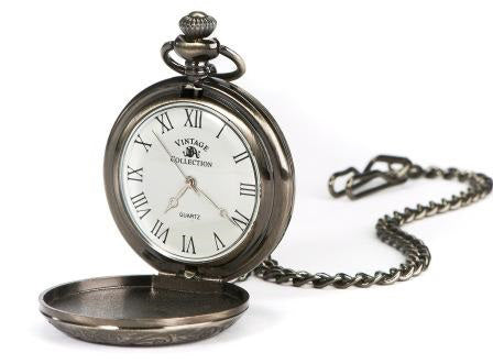 Gunmetal silver pocket watch opened to show white watch face with black roman numerals.